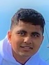 Kush Patel sitting on a rock at the White Mountain in New Hempshire